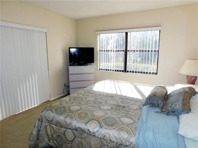 First floor end unit condo located in the Woodlake Run area of on East Lake Woodlands Country Club in Florida - for sale on GolfHomes.com, golf home, golf lot