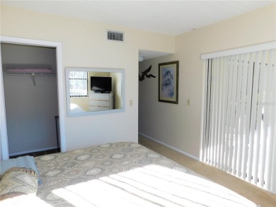 First floor end unit condo located in the Woodlake Run area of on East Lake Woodlands Country Club in Florida - for sale on GolfHomes.com, golf home, golf lot