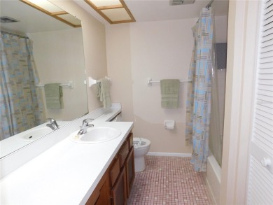 First floor end unit condo located in the Woodlake Run area of on East Lake Woodlands Country Club in Florida - for sale on GolfHomes.com, golf home, golf lot