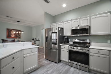 BOND PAID! STUNNING TURNKEY SOMERSET MODEL WITH GOLF CART on The Links of Spruce Creek in Florida - for sale on GolfHomes.com, golf home, golf lot