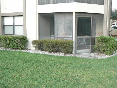 First floor end unit condo located in the Woodlake Run area of on East Lake Woodlands Country Club in Florida - for sale on GolfHomes.com, golf home, golf lot