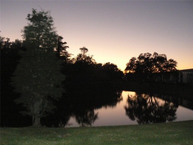 First floor end unit condo located in the Woodlake Run area of on East Lake Woodlands Country Club in Florida - for sale on GolfHomes.com, golf home, golf lot
