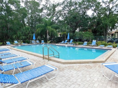 First floor end unit condo located in the Woodlake Run area of on East Lake Woodlands Country Club in Florida - for sale on GolfHomes.com, golf home, golf lot