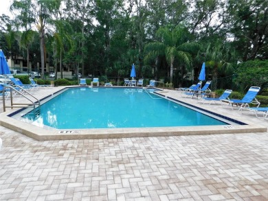 First floor end unit condo located in the Woodlake Run area of on East Lake Woodlands Country Club in Florida - for sale on GolfHomes.com, golf home, golf lot