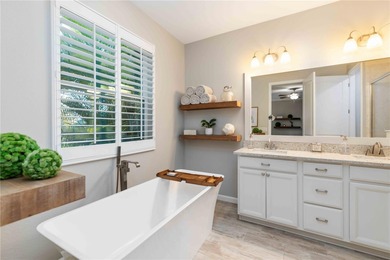 Discover refined Florida living in this beautifully updated pool on Esplanade Golf and Country at Lakewood Ranch in Florida - for sale on GolfHomes.com, golf home, golf lot