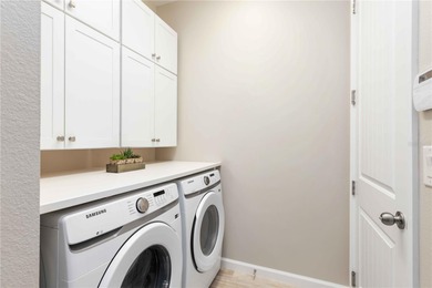 Discover refined Florida living in this beautifully updated pool on Esplanade Golf and Country at Lakewood Ranch in Florida - for sale on GolfHomes.com, golf home, golf lot