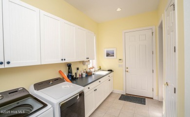 Beautiful low-maintenance brick home with amazing curb appeal on Ocean Ridge Plantation in North Carolina - for sale on GolfHomes.com, golf home, golf lot