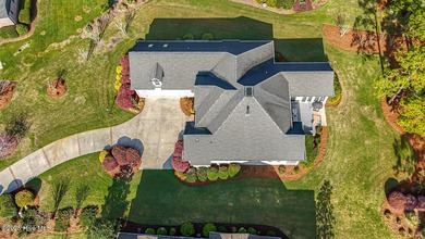 Beautiful low-maintenance brick home with amazing curb appeal on Ocean Ridge Plantation in North Carolina - for sale on GolfHomes.com, golf home, golf lot