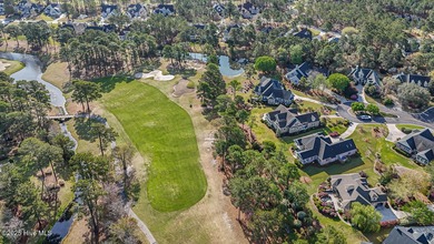 Beautiful low-maintenance brick home with amazing curb appeal on Ocean Ridge Plantation in North Carolina - for sale on GolfHomes.com, golf home, golf lot