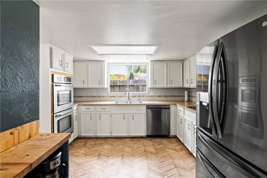 Located in the heart of Corpus Christi, this spacious two-story on Corpus Christi Country Club Golf Course in Texas - for sale on GolfHomes.com, golf home, golf lot