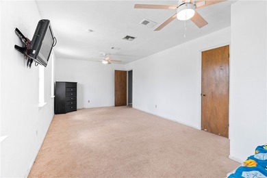 Located in the heart of Corpus Christi, this spacious two-story on Corpus Christi Country Club Golf Course in Texas - for sale on GolfHomes.com, golf home, golf lot