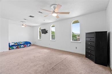 Located in the heart of Corpus Christi, this spacious two-story on Corpus Christi Country Club Golf Course in Texas - for sale on GolfHomes.com, golf home, golf lot