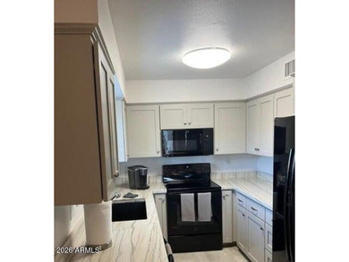 This exceptionally beautifully updated single-level end-unit on Apache Wells Country Club in Arizona - for sale on GolfHomes.com, golf home, golf lot