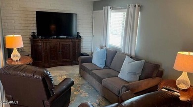 This exceptionally beautifully updated single-level end-unit on Apache Wells Country Club in Arizona - for sale on GolfHomes.com, golf home, golf lot