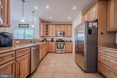 Resort-style living at its finest in this quiet, top-floor end on The Peninsula Golf and Country Club in Delaware - for sale on GolfHomes.com, golf home, golf lot