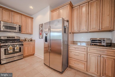 Resort-style living at its finest in this quiet, top-floor end on The Peninsula Golf and Country Club in Delaware - for sale on GolfHomes.com, golf home, golf lot