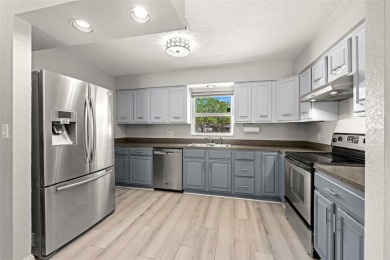 Welcome to effortless Florida living in this beautifully on The Dunedin Country Club in Florida - for sale on GolfHomes.com, golf home, golf lot