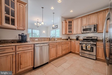 Resort-style living at its finest in this quiet, top-floor end on The Peninsula Golf and Country Club in Delaware - for sale on GolfHomes.com, golf home, golf lot