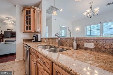 Resort-style living at its finest in this quiet, top-floor end on The Peninsula Golf and Country Club in Delaware - for sale on GolfHomes.com, golf home, golf lot