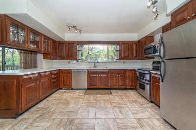 Experience the perfect blend of timeless design and modern on Ann Arbor Country Club in Michigan - for sale on GolfHomes.com, golf home, golf lot