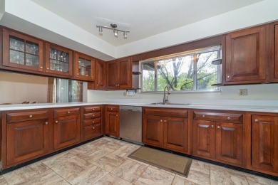 Experience the perfect blend of timeless design and modern on Ann Arbor Country Club in Michigan - for sale on GolfHomes.com, golf home, golf lot