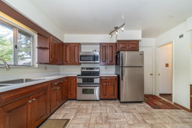 Experience the perfect blend of timeless design and modern on Ann Arbor Country Club in Michigan - for sale on GolfHomes.com, golf home, golf lot