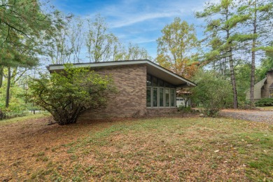 Experience the perfect blend of timeless design and modern on Ann Arbor Country Club in Michigan - for sale on GolfHomes.com, golf home, golf lot