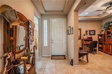 Listing courtesy of Lori Robinson, Coldwell Banker ABR on Menifee Lakes Country Club - Lakes in California - for sale on GolfHomes.com, golf home, golf lot