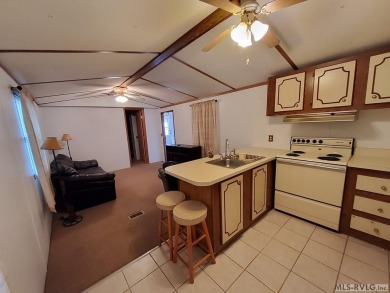 Comfy home in a water front community with lake access. This 2 on River Ridge Golf Club in Virginia - for sale on GolfHomes.com, golf home, golf lot