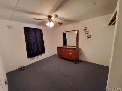 Comfy home in a water front community with lake access. This 2 on River Ridge Golf Club in Virginia - for sale on GolfHomes.com, golf home, golf lot