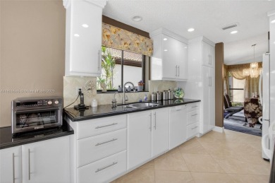 Tucked into an all-age country club in scenic west Boca Raton on  in Florida - for sale on GolfHomes.com, golf home, golf lot