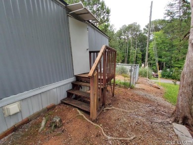 Comfy home in a water front community with lake access. This 2 on River Ridge Golf Club in Virginia - for sale on GolfHomes.com, golf home, golf lot