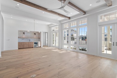 Less than a mile from the beach, this breathtaking new on Regatta Bay Golf and Country Club in Florida - for sale on GolfHomes.com, golf home, golf lot