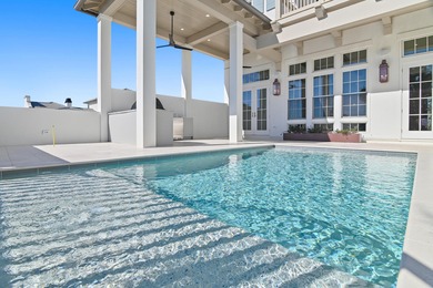 Less than a mile from the beach, this breathtaking new on Regatta Bay Golf and Country Club in Florida - for sale on GolfHomes.com, golf home, golf lot