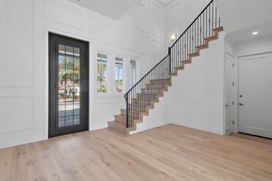 Less than a mile from the beach, this breathtaking new on Regatta Bay Golf and Country Club in Florida - for sale on GolfHomes.com, golf home, golf lot