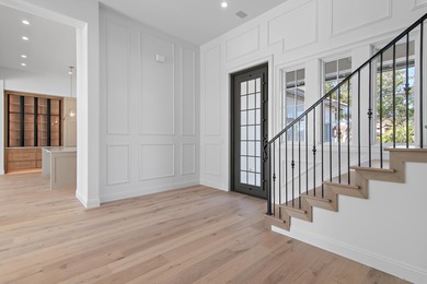 Less than a mile from the beach, this breathtaking new on Regatta Bay Golf and Country Club in Florida - for sale on GolfHomes.com, golf home, golf lot