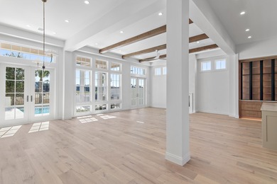 Less than a mile from the beach, this breathtaking new on Regatta Bay Golf and Country Club in Florida - for sale on GolfHomes.com, golf home, golf lot