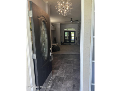 Nestled in the sought-after Southern Links community of Fleming on Golf Club At Fleming Island in Florida - for sale on GolfHomes.com, golf home, golf lot
