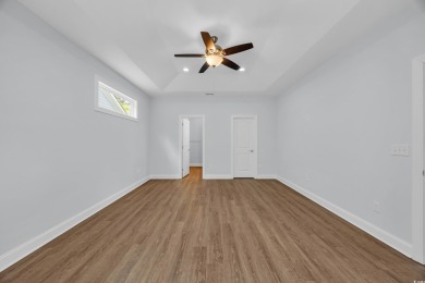 This cottage style home offers three bedrooms and two fully on Beachwood Golf Club in South Carolina - for sale on GolfHomes.com, golf home, golf lot