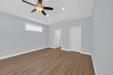 This cottage style home offers three bedrooms and two fully on Beachwood Golf Club in South Carolina - for sale on GolfHomes.com, golf home, golf lot