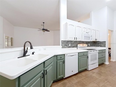 Welcome to this beautifully maintained 3-bedroom, 2-bath home on Lakes of Lady Lake Golf Course in Florida - for sale on GolfHomes.com, golf home, golf lot