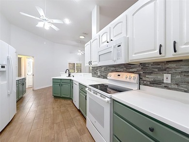 Welcome to this beautifully maintained 3-bedroom, 2-bath home on Lakes of Lady Lake Golf Course in Florida - for sale on GolfHomes.com, golf home, golf lot