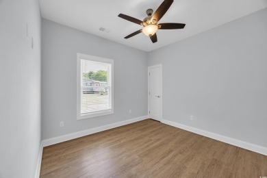 This cottage style home offers three bedrooms and two fully on Beachwood Golf Club in South Carolina - for sale on GolfHomes.com, golf home, golf lot