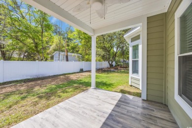 This cottage style home offers three bedrooms and two fully on Beachwood Golf Club in South Carolina - for sale on GolfHomes.com, golf home, golf lot