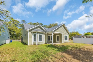 This cottage style home offers three bedrooms and two fully on Beachwood Golf Club in South Carolina - for sale on GolfHomes.com, golf home, golf lot