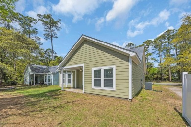 This cottage style home offers three bedrooms and two fully on Beachwood Golf Club in South Carolina - for sale on GolfHomes.com, golf home, golf lot