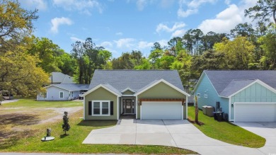 This cottage style home offers three bedrooms and two fully on Beachwood Golf Club in South Carolina - for sale on GolfHomes.com, golf home, golf lot