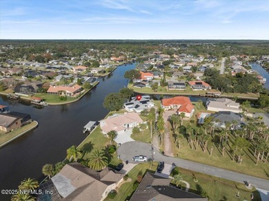Welcome to true waterfront living in Palm Coast, positioned on a on Palm Harbor Golf Club in Florida - for sale on GolfHomes.com, golf home, golf lot