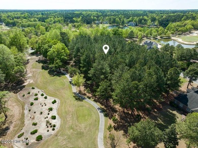 Located near the tee box of hole #14 of The Landing Course on River Landing Golf Course in North Carolina - for sale on GolfHomes.com, golf home, golf lot