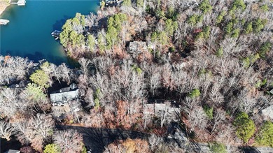 Embrace lake life at Lake Keowee with this exceptional on Keowee Key Golf and Country Club in South Carolina - for sale on GolfHomes.com, golf home, golf lot